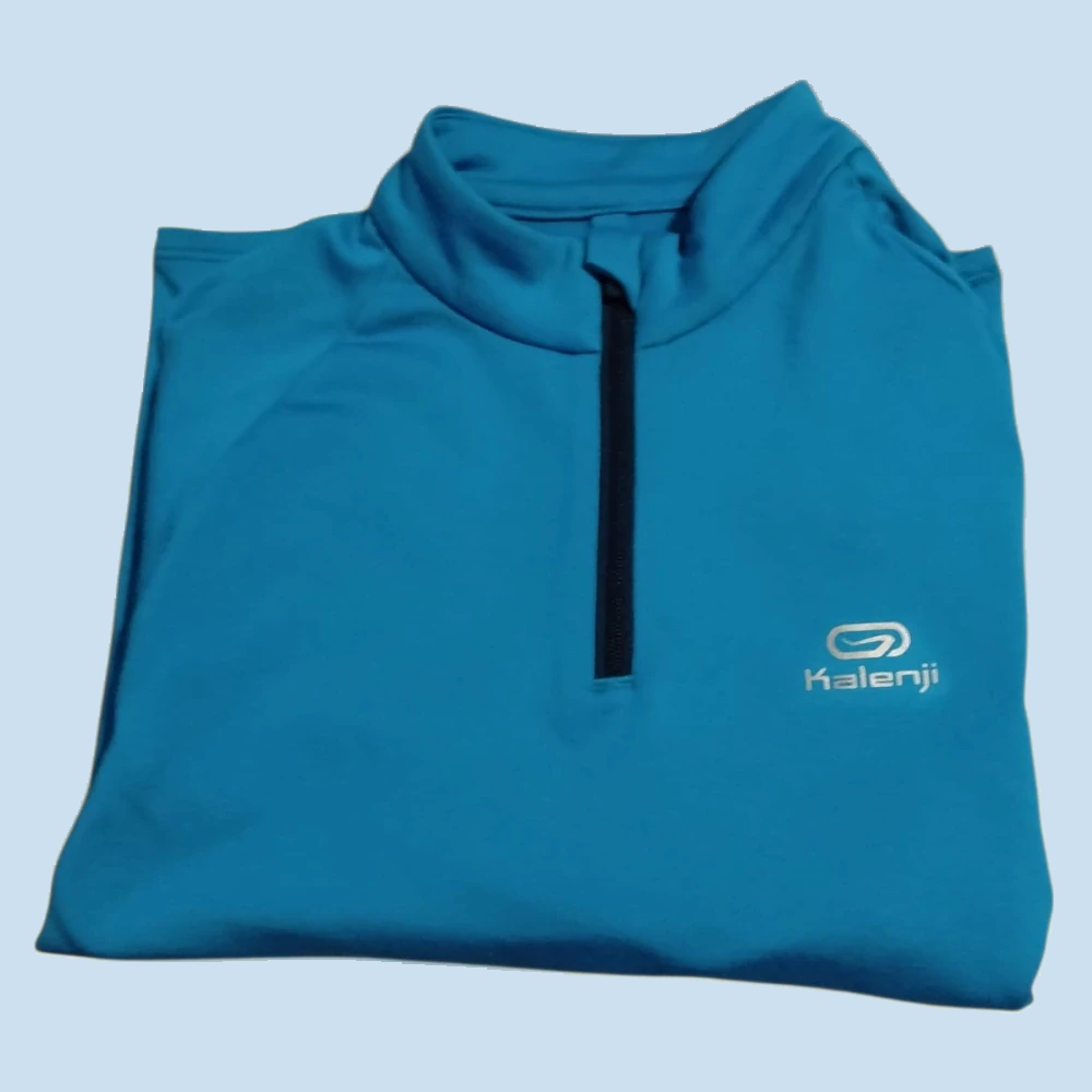 Tyrkysový sportovní top Kalenji, vel. 122